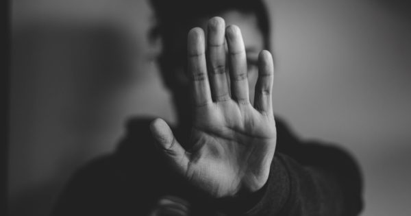 close-up photography of person lifting hands